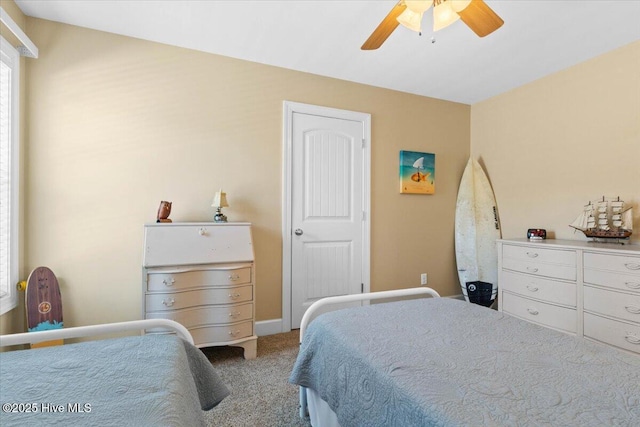 bedroom featuring light colored carpet and ceiling fan