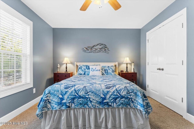 bedroom featuring ceiling fan and carpet