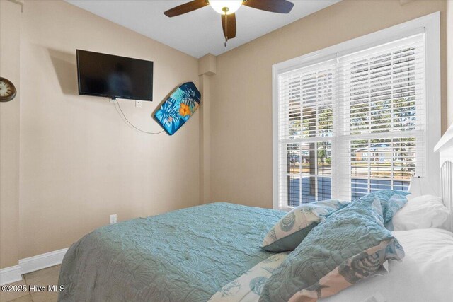 bedroom with lofted ceiling and ceiling fan