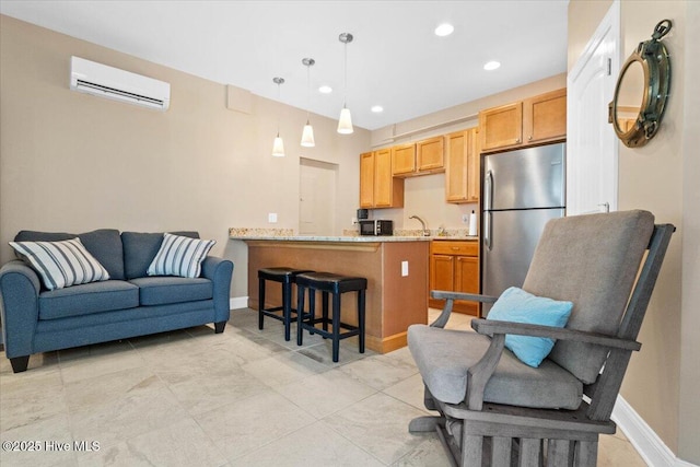 living room featuring sink and a wall unit AC