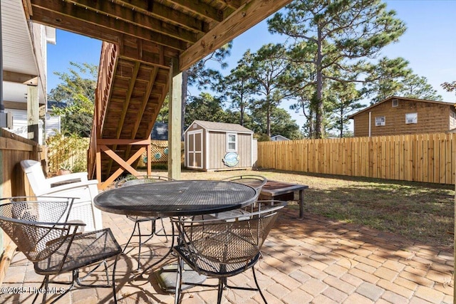 view of patio / terrace with a storage shed