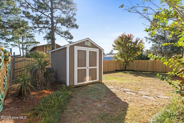 view of outbuilding featuring a lawn