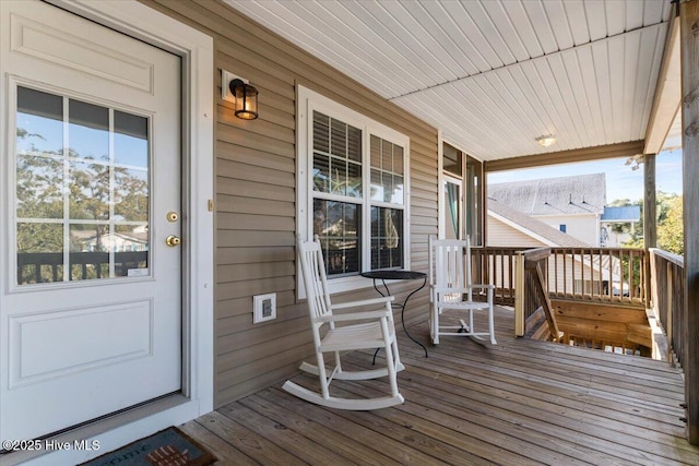 wooden deck featuring covered porch