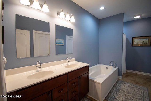 bathroom with vanity and a tub to relax in