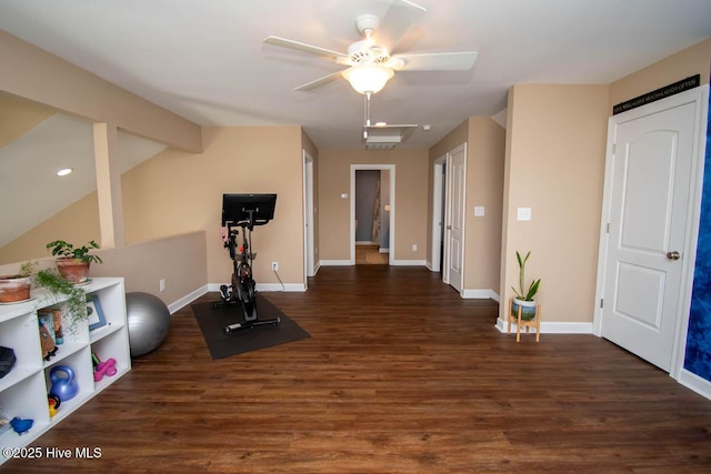 workout area featuring vaulted ceiling, dark hardwood / wood-style floors, and ceiling fan