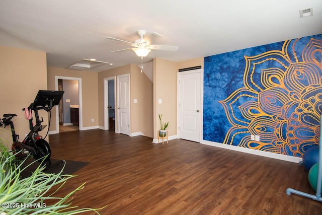 exercise room featuring ceiling fan and dark hardwood / wood-style flooring