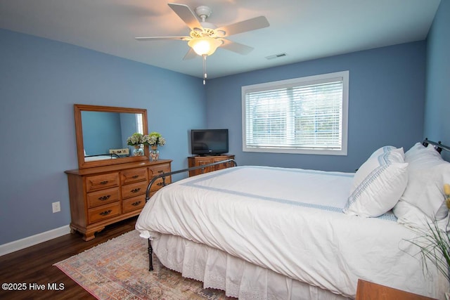 bedroom featuring dark wood-type flooring and ceiling fan