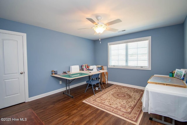 office area featuring dark hardwood / wood-style flooring and ceiling fan