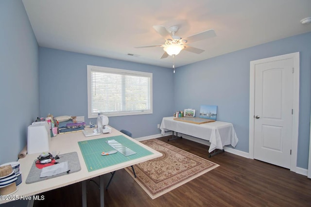 office space featuring ceiling fan and dark hardwood / wood-style floors