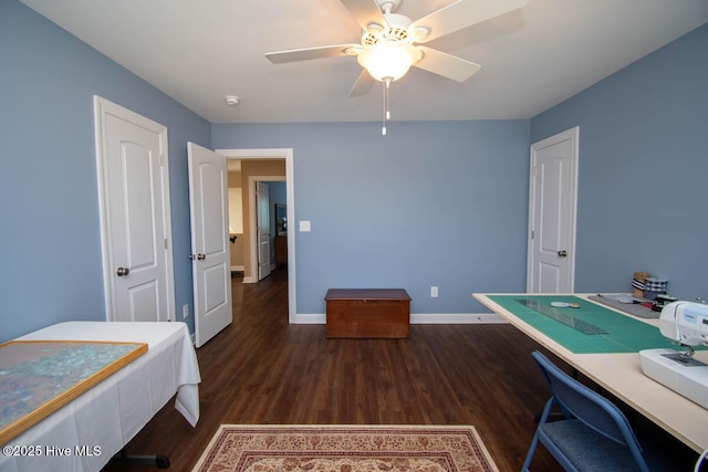 interior space featuring ceiling fan and dark hardwood / wood-style flooring