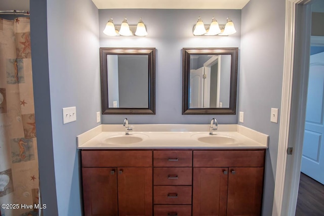 bathroom with a shower with curtain and vanity