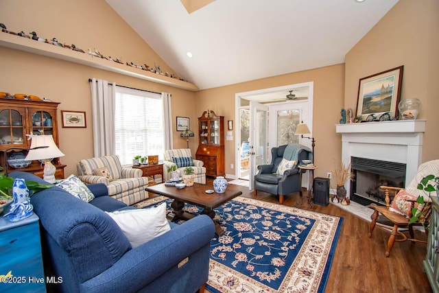 living room featuring lofted ceiling and dark hardwood / wood-style floors