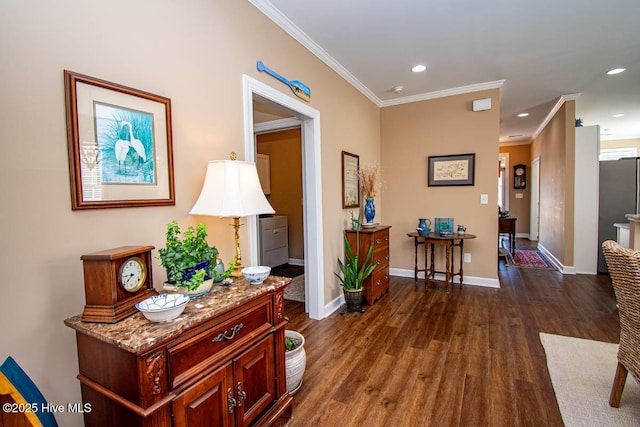 hallway with dark wood-type flooring and ornamental molding