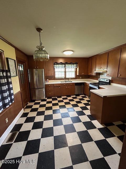 2030 US Highway 17, Merry Hill, NC 27957 - kitchen featuring appliances with stainless steel finishes, light floors, light countertops, under cabinet range hood, and pendant lighting
