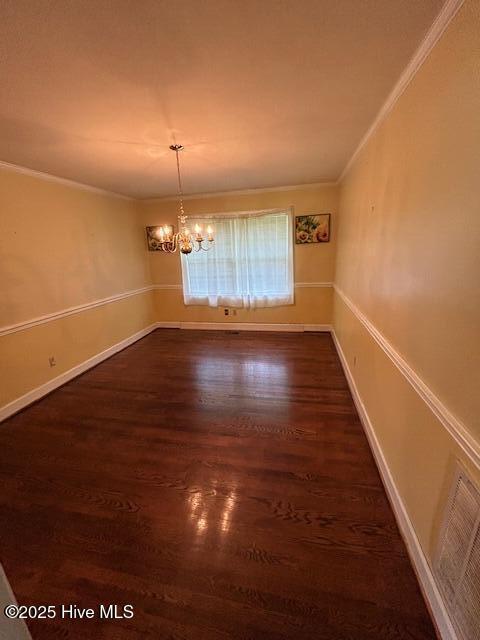 2030 US Highway 17, Merry Hill, NC 27957 - spare room featuring ornamental molding, dark wood finished floors, a chandelier, and baseboards