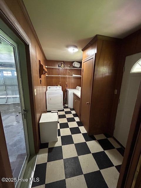 2030 US Highway 17, Merry Hill, NC 27957 - laundry room with washer and dryer, light flooring, wood walls, and cabinet space