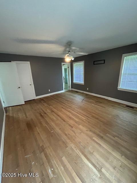2030 US Highway 17, Merry Hill, NC 27957 - unfurnished bedroom featuring wood finished floors, baseboards, and a ceiling fan