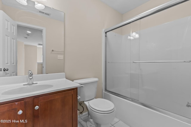 bathroom with visible vents, enclosed tub / shower combo, toilet, tile patterned floors, and vanity