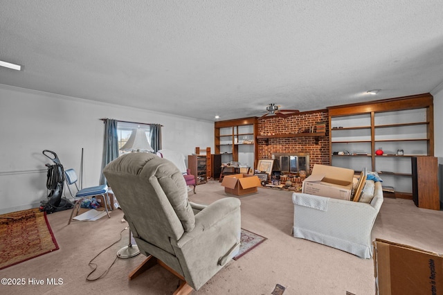 living room featuring ceiling fan, light carpet, a textured ceiling, and a fireplace