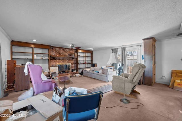 carpeted living room featuring crown molding, ceiling fan, a brick fireplace, and a textured ceiling