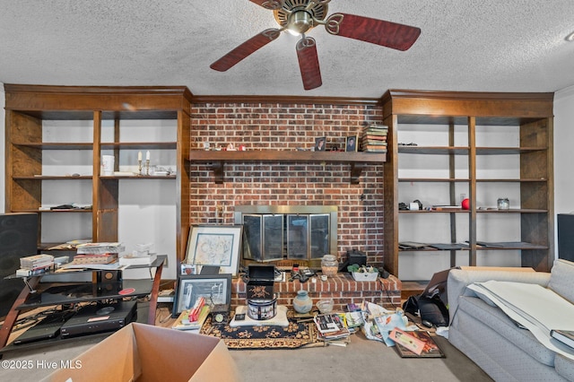 living room with crown molding, concrete flooring, a brick fireplace, and a textured ceiling