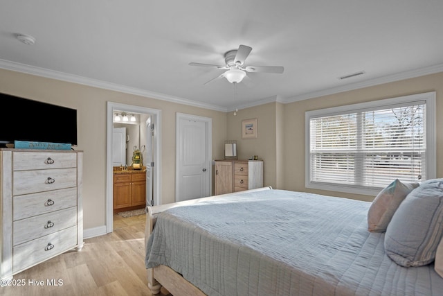 bedroom featuring connected bathroom, crown molding, and light hardwood / wood-style floors