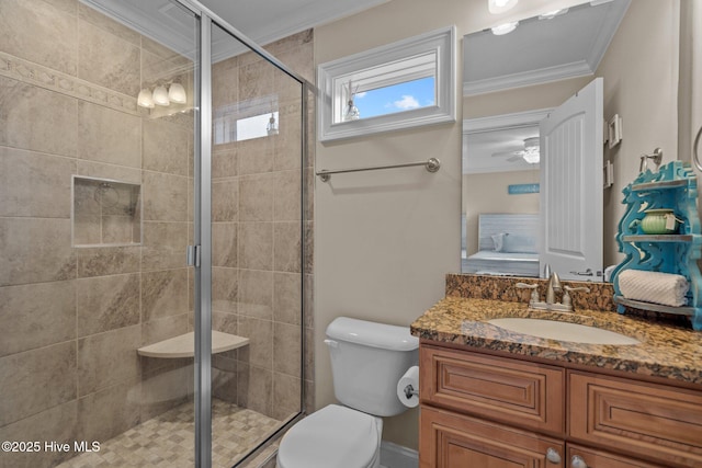 bathroom with crown molding, toilet, and a shower with shower door