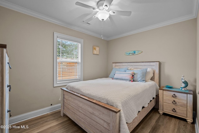 bedroom featuring ornamental molding, ceiling fan, and dark hardwood / wood-style flooring