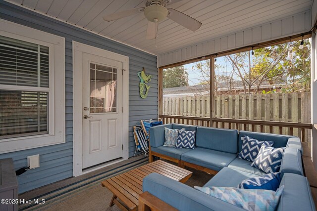 sunroom / solarium featuring wooden ceiling and ceiling fan