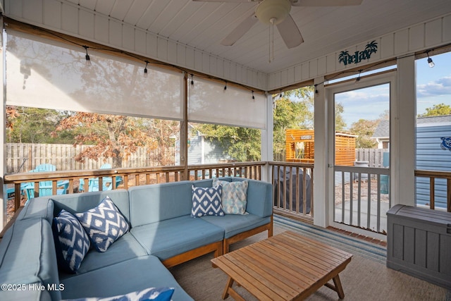 sunroom / solarium with ceiling fan