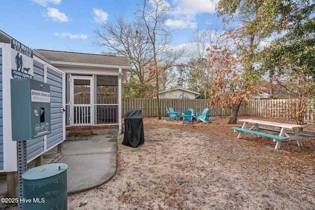 view of yard with a patio and a sunroom