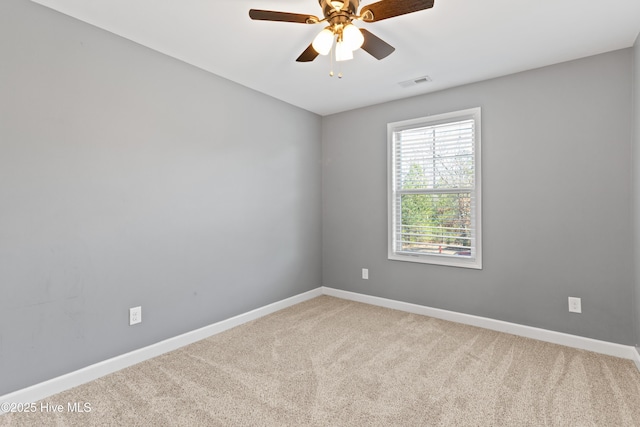 unfurnished room with ceiling fan and carpet floors