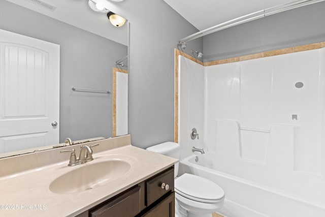 full bathroom with vanity, shower / washtub combination, and toilet