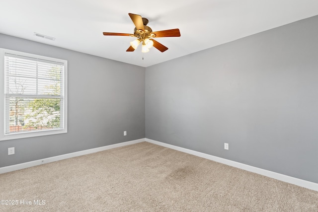 carpeted empty room with ceiling fan