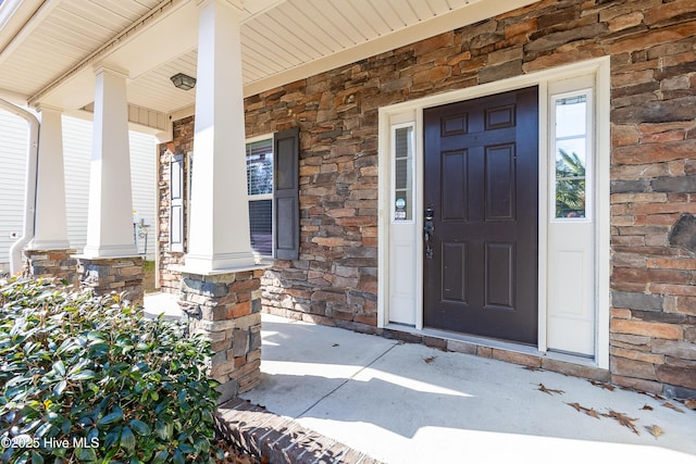 property entrance with covered porch