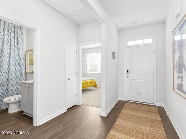 foyer entrance with dark hardwood / wood-style floors