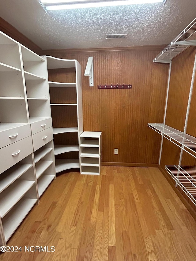 walk in closet featuring wood-type flooring