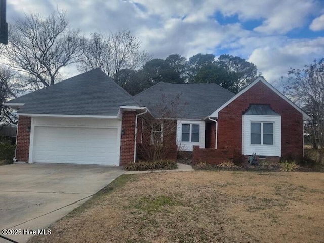 ranch-style house with a garage and a front lawn