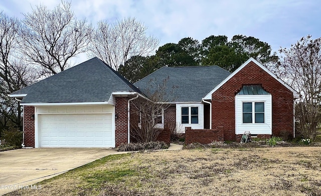 view of front facade with a garage, concrete driveway, brick siding, and a shingled roof