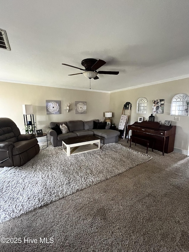 carpeted living area featuring ceiling fan, ornamental molding, and visible vents