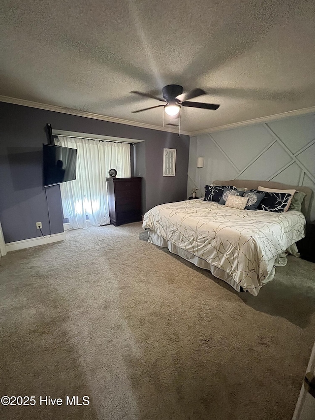 unfurnished bedroom featuring a ceiling fan, carpet flooring, crown molding, and a textured ceiling