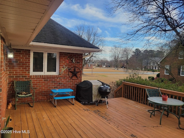 wooden terrace with area for grilling