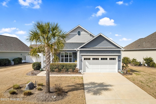 view of front of property with driveway and an attached garage