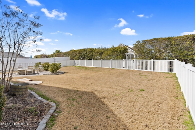 view of yard featuring a fenced backyard, a patio, and a gazebo