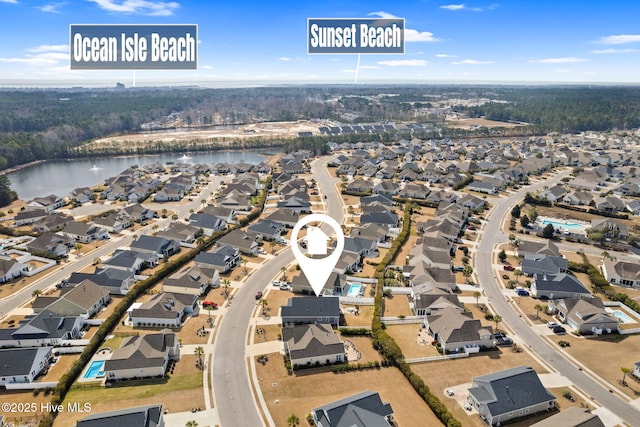 birds eye view of property featuring a water view and a residential view