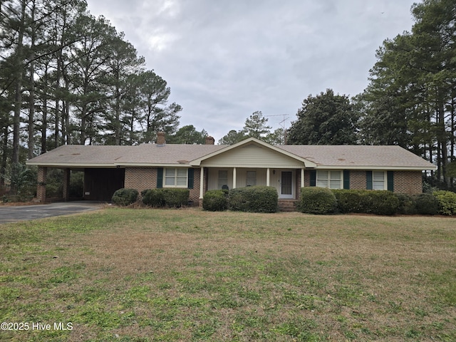 single story home with a carport and a front lawn