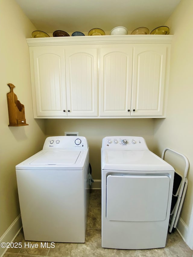 laundry area with cabinets and independent washer and dryer