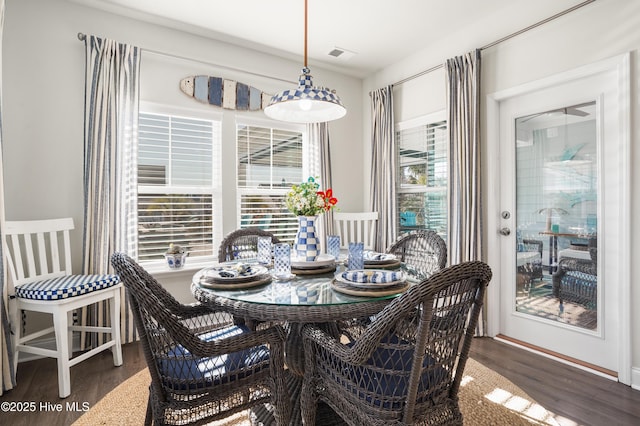 dining room with dark hardwood / wood-style flooring