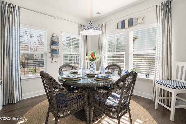 dining space featuring dark hardwood / wood-style flooring