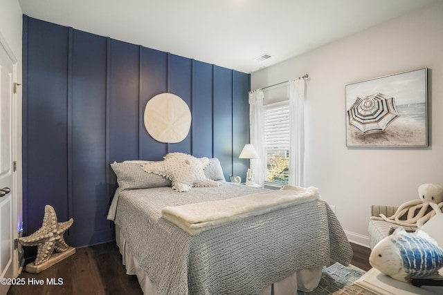 bedroom with hardwood / wood-style flooring